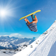 Snowboarder-flipping-through-air